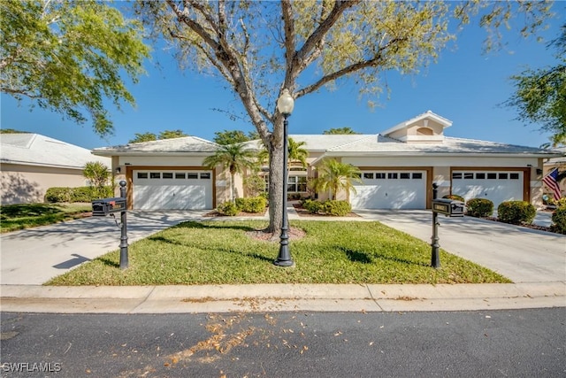 view of front of home with concrete driveway, an attached garage, and stucco siding