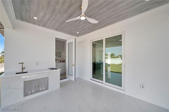 view of patio featuring an outdoor kitchen and a ceiling fan