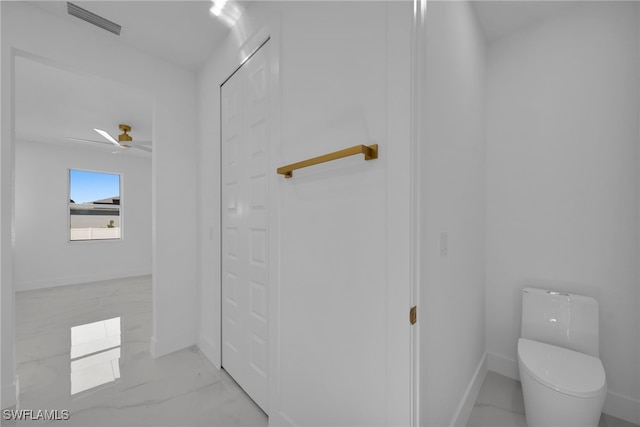 bathroom with a ceiling fan, visible vents, baseboards, toilet, and marble finish floor