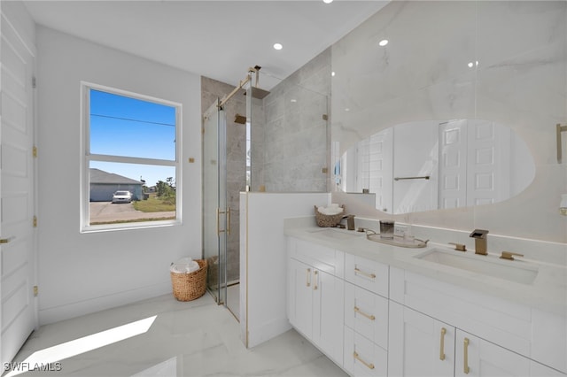 full bathroom featuring a shower stall, double vanity, marble finish floor, and a sink