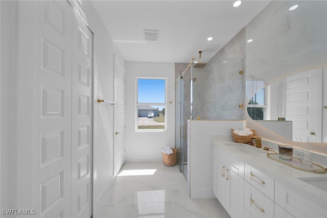 full bath featuring visible vents, double vanity, a stall shower, a sink, and marble finish floor