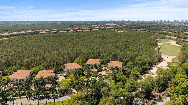 drone / aerial view featuring a view of trees