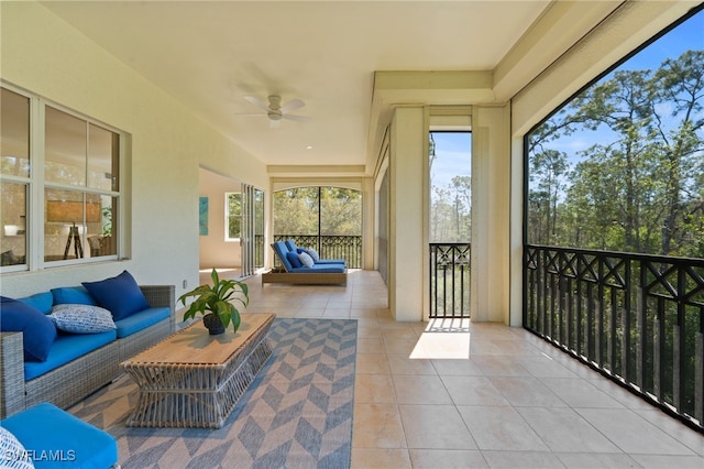 sunroom / solarium with ceiling fan