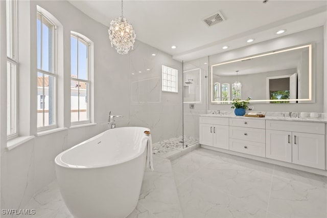 full bathroom with visible vents, marble finish floor, a marble finish shower, double vanity, and a freestanding bath