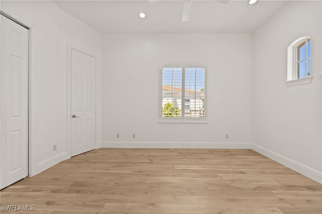 spare room with recessed lighting, baseboards, ceiling fan, and light wood finished floors