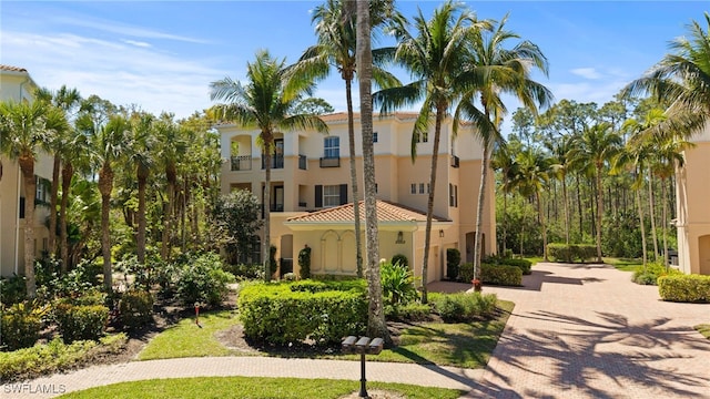 view of property featuring decorative driveway