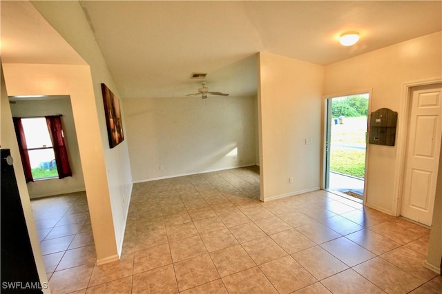 entryway with light tile patterned floors, baseboards, visible vents, and ceiling fan