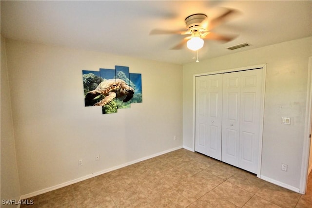 unfurnished bedroom featuring visible vents, baseboards, a closet, and ceiling fan