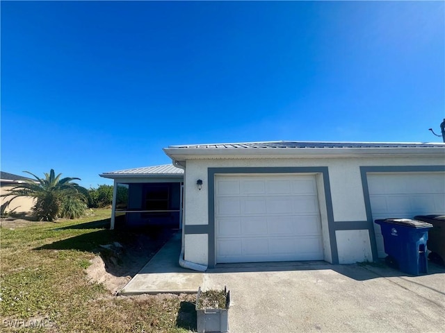 exterior space with concrete driveway