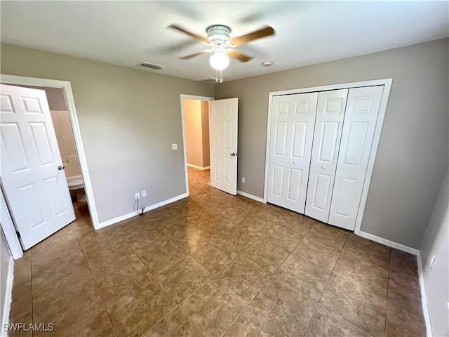 unfurnished bedroom featuring a ceiling fan, baseboards, visible vents, and a closet