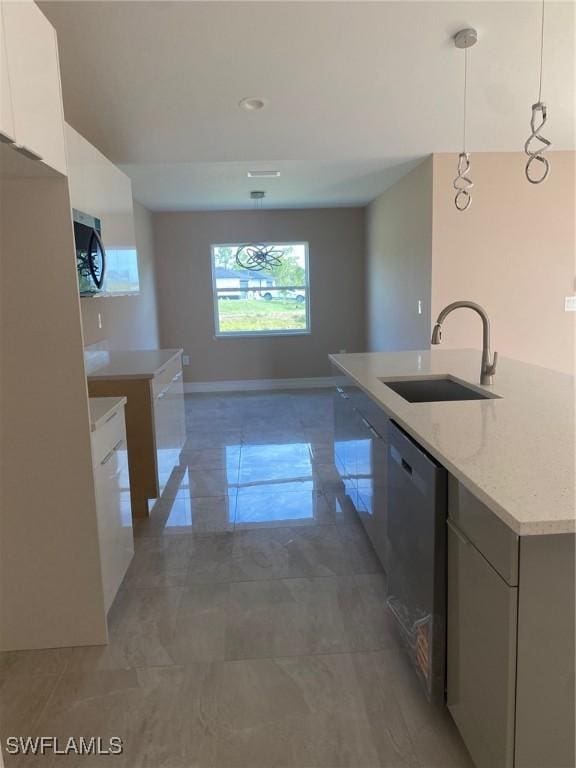 kitchen featuring a sink, modern cabinets, marble finish floor, white cabinets, and appliances with stainless steel finishes