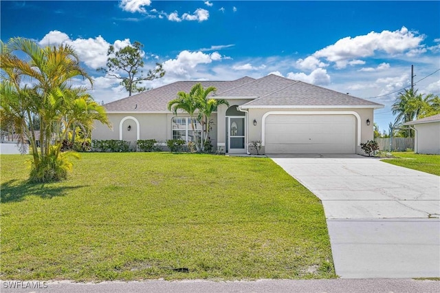 view of front of property featuring stucco siding, an attached garage, and a front lawn