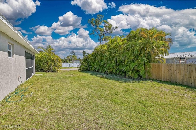 view of yard featuring fence