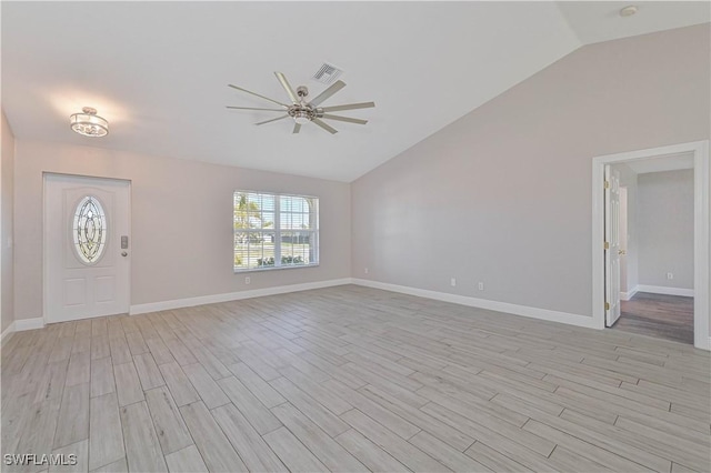 entryway with baseboards, visible vents, lofted ceiling, ceiling fan, and light wood-style floors