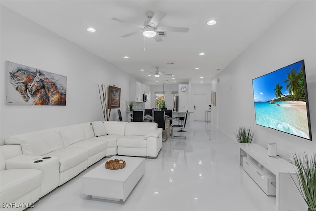 living room featuring recessed lighting and ceiling fan