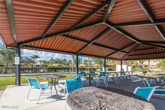 view of patio with a gazebo and outdoor dining area