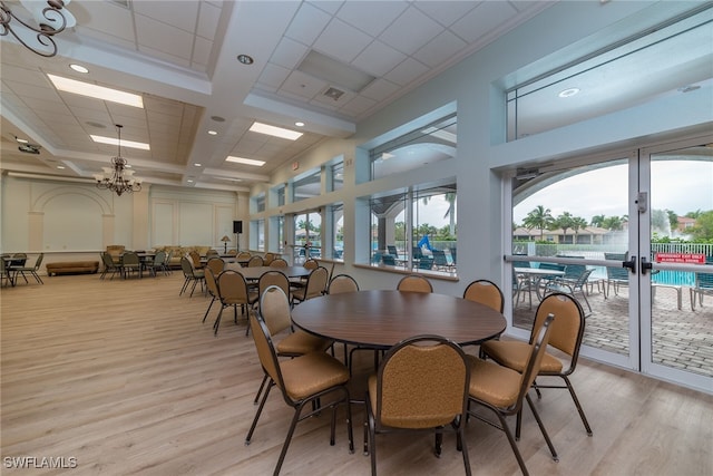 dining space with recessed lighting, light wood-type flooring, visible vents, and a chandelier