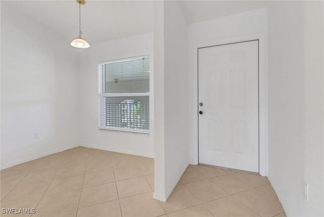 foyer entrance featuring light tile patterned floors