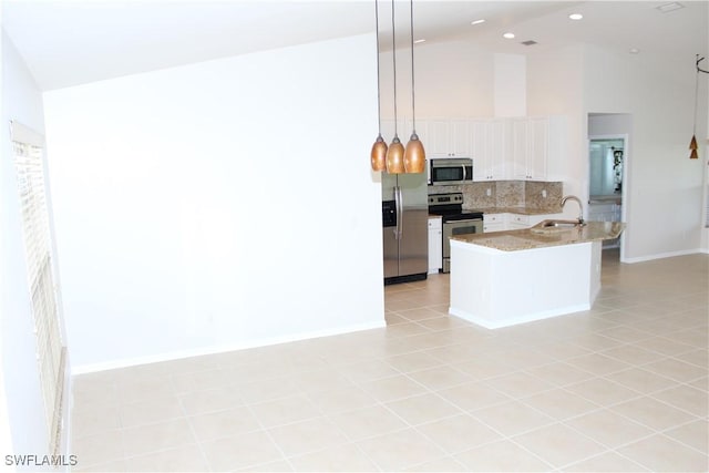 kitchen with light tile patterned floors, stainless steel appliances, tasteful backsplash, and high vaulted ceiling