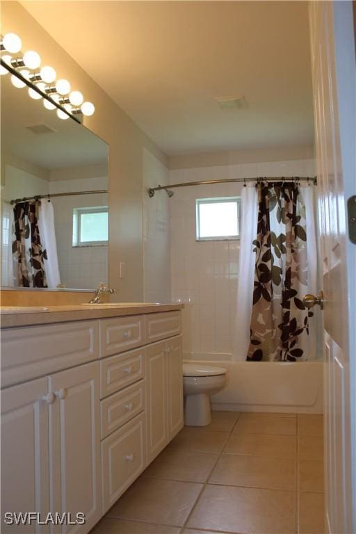 bathroom featuring vanity, shower / bathtub combination with curtain, visible vents, tile patterned floors, and toilet