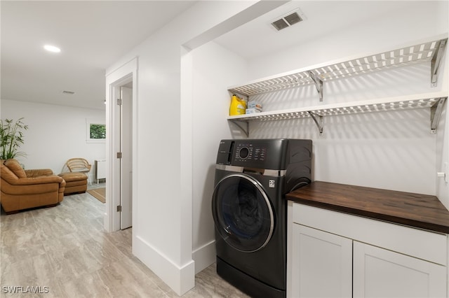 laundry room featuring recessed lighting, visible vents, washer / dryer, and laundry area