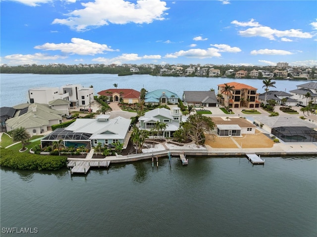 birds eye view of property featuring a residential view and a water view