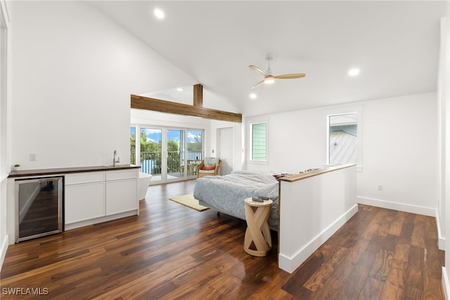 bedroom with recessed lighting, wine cooler, access to exterior, and dark wood finished floors