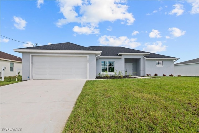 view of front of home with a front yard, an attached garage, driveway, and stucco siding