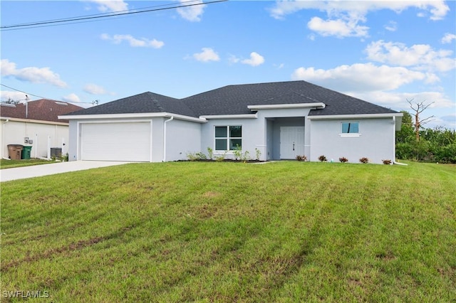 single story home with stucco siding, an attached garage, driveway, and a front yard