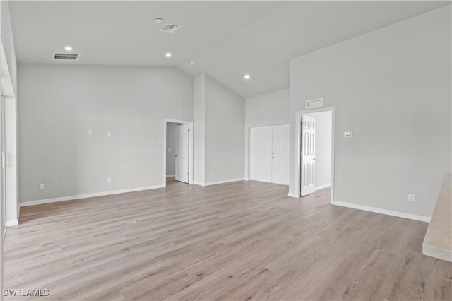 unfurnished room with visible vents, baseboards, and light wood-style flooring