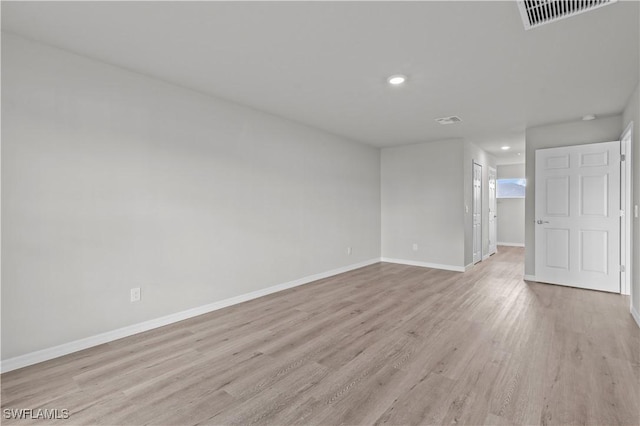 unfurnished room with recessed lighting, visible vents, baseboards, and light wood-style flooring