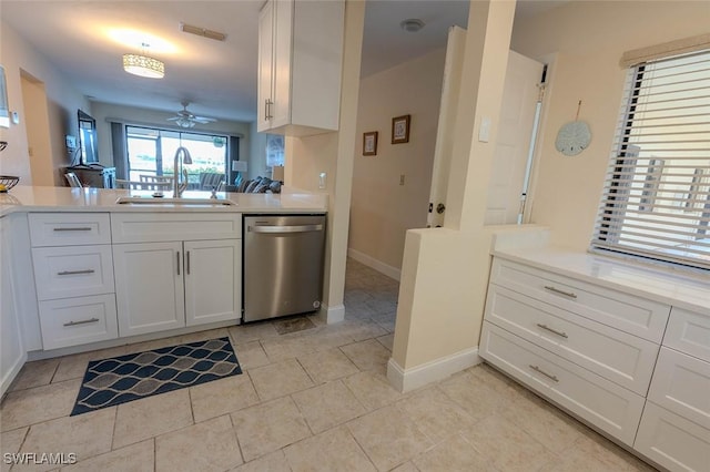 kitchen featuring visible vents, dishwasher, light countertops, a ceiling fan, and a sink