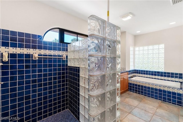 full bathroom with a bath, visible vents, and walk in shower