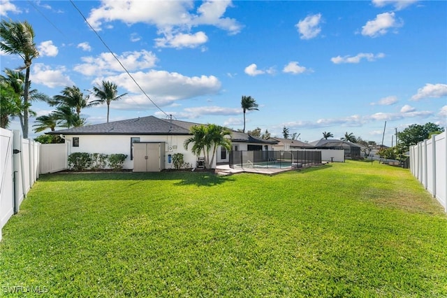 view of yard with a fenced in pool and a fenced backyard