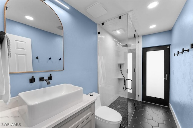 full bathroom featuring vanity, recessed lighting, a stall shower, tile patterned flooring, and toilet