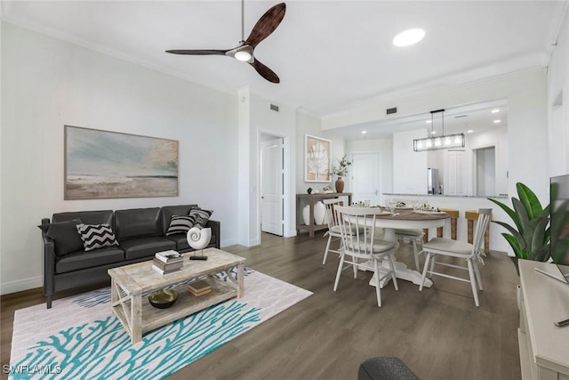 living room featuring visible vents, dark wood-type flooring, recessed lighting, crown molding, and baseboards