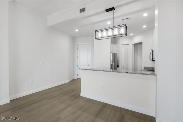 kitchen featuring light stone countertops, baseboards, dark wood-style flooring, stainless steel appliances, and white cabinetry