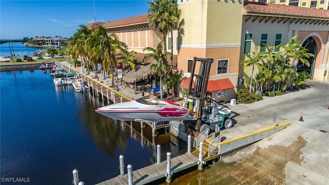 dock area featuring a water view and boat lift