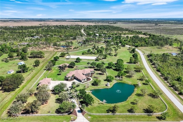 drone / aerial view with a water view and a rural view