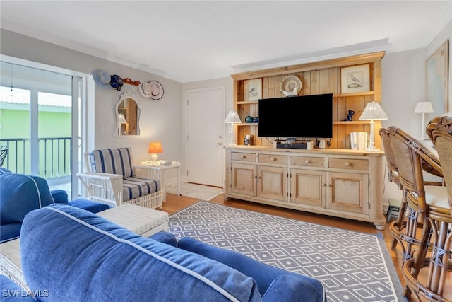 living area with baseboards and light wood finished floors