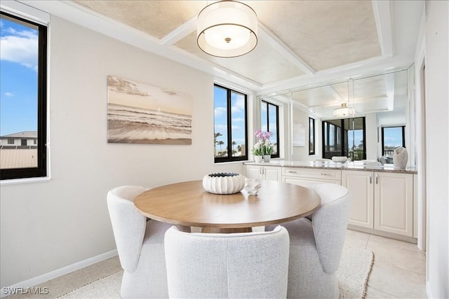 dining room featuring light tile patterned floors and baseboards