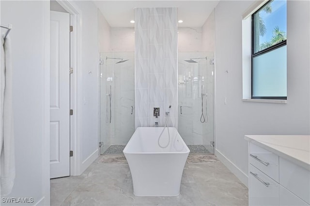 bathroom with vanity, a soaking tub, marble finish floor, and a marble finish shower