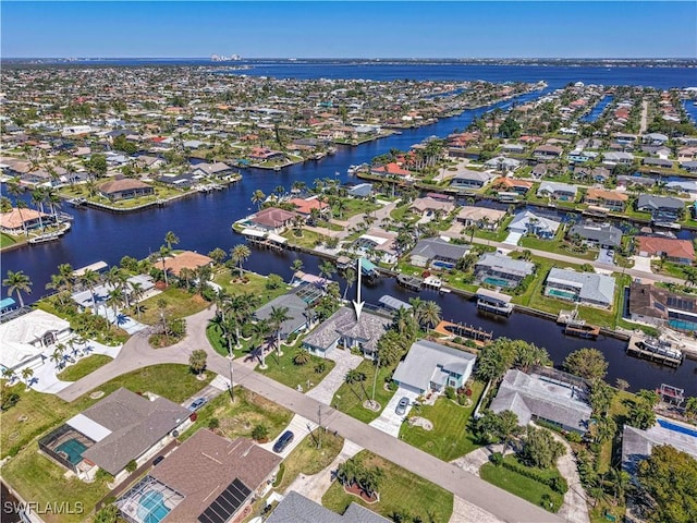 birds eye view of property with a residential view and a water view