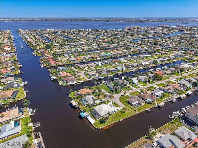 aerial view with a residential view and a water view