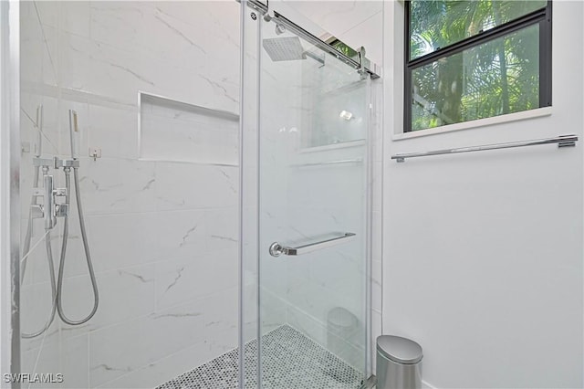 bathroom featuring a shower stall