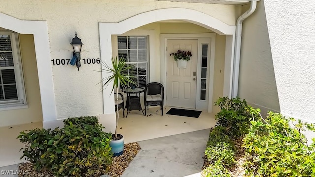 10139 Colonial Country Club Blvd S Unit 1006, Fort Myers, FL 33913 - doorway to property featuring stucco siding