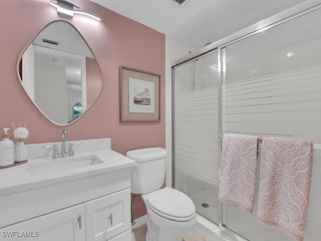 full bath featuring visible vents, a stall shower, toilet, and vanity