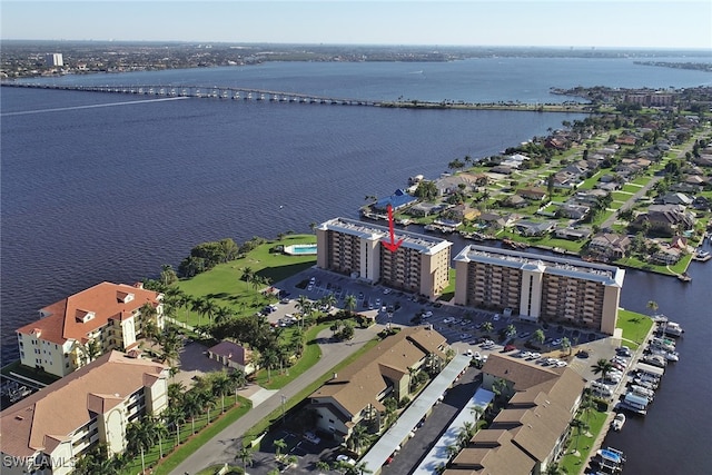 birds eye view of property featuring a water view