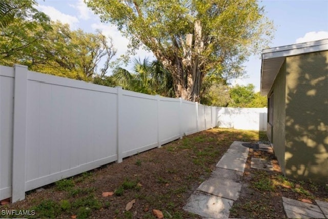 view of yard with a fenced backyard