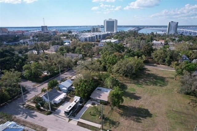 aerial view featuring a view of city and a water view